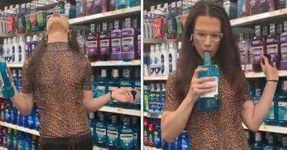 A person is seen on Walmart using a bottle of mouthwash and then putting it back on the shelf.