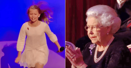 Girl was preforming in front of the queen of England when her service father surprises her