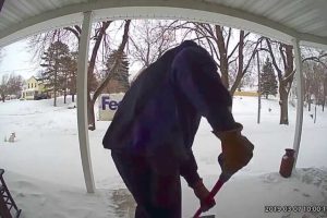 Kind man helps a widow by cleaning her porch out of the snow after learning that her husband passed away