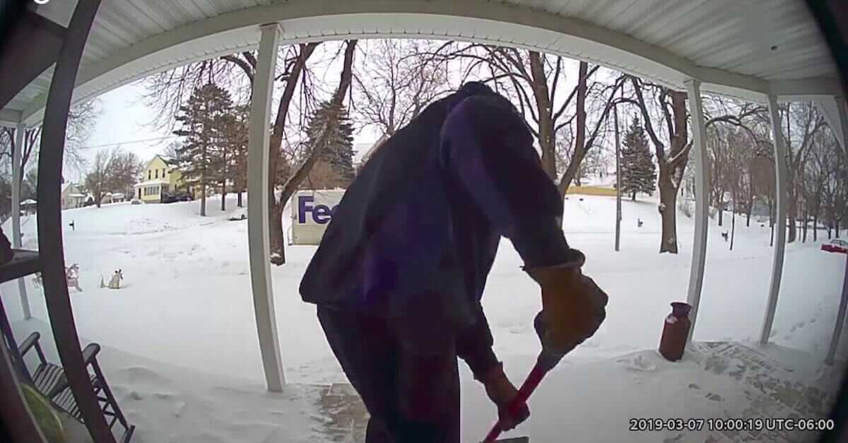 Kind man helps a widow by cleaning her porch out of the snow after learning that her husband passed away