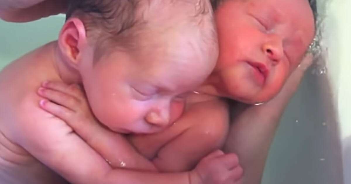 Newborn twins don’t realize they’ve been born, refuse to stop cuddling like they did in the womb