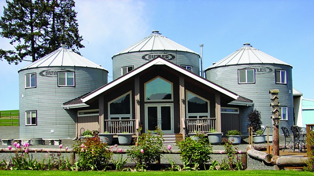 There Is A Farmhouse Built Out Of Grain Silos