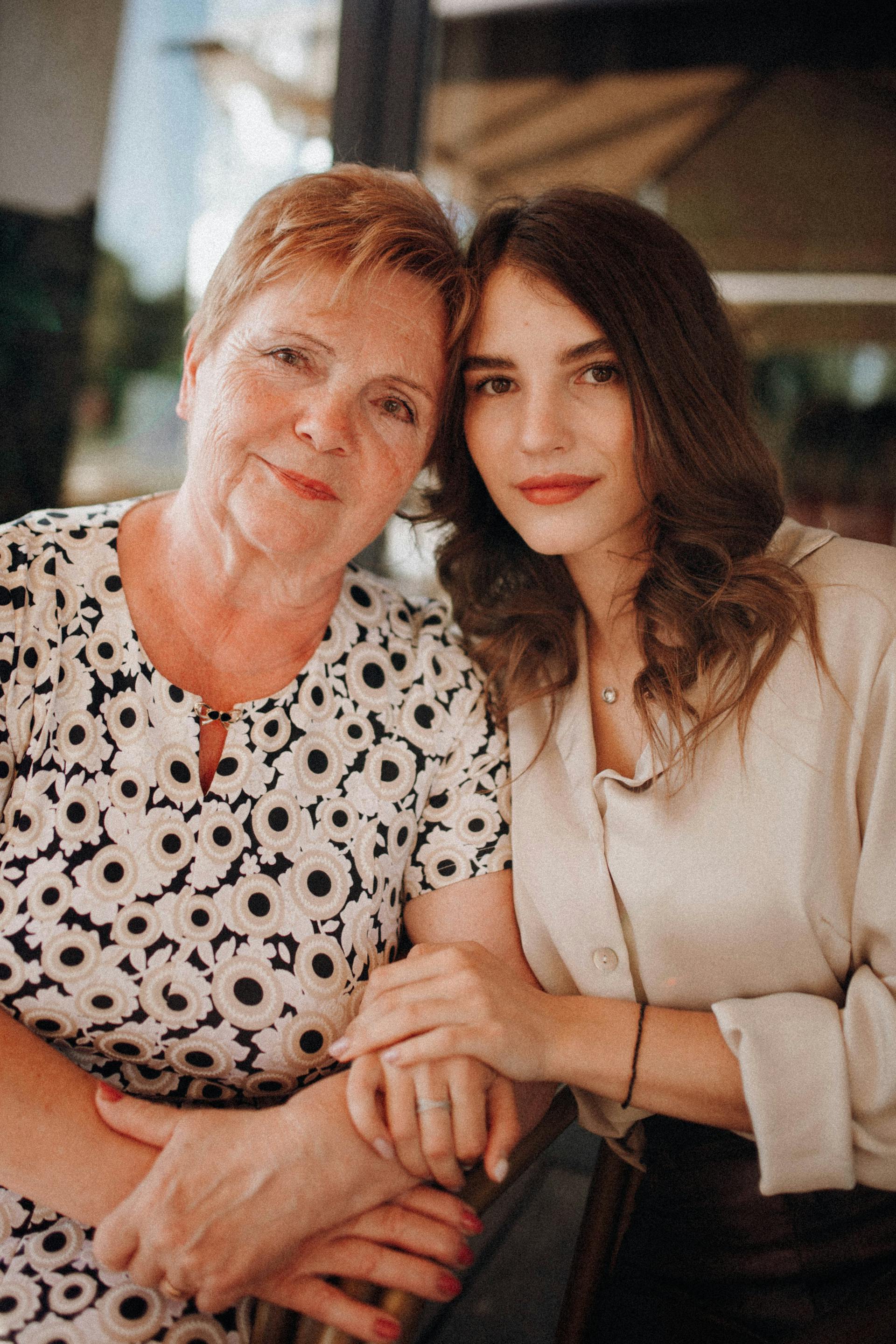 A woman sitting close to her senior mom | Source: Pexels