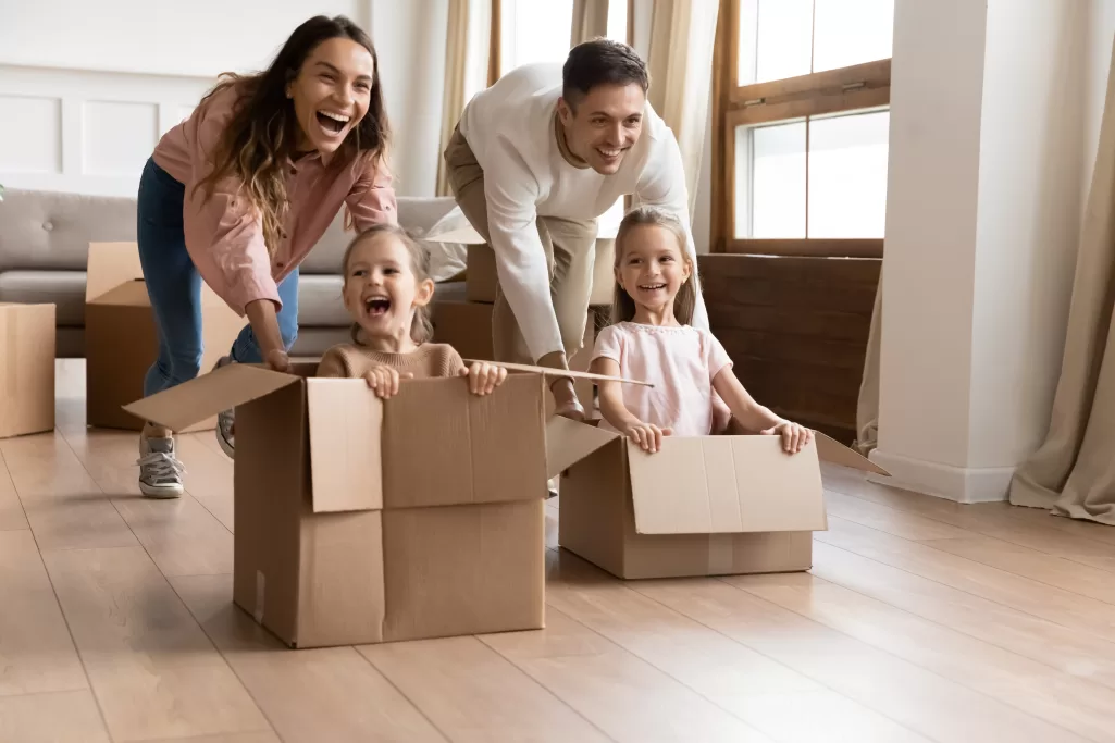 A couple playing with two girls | Source: Shutterstock