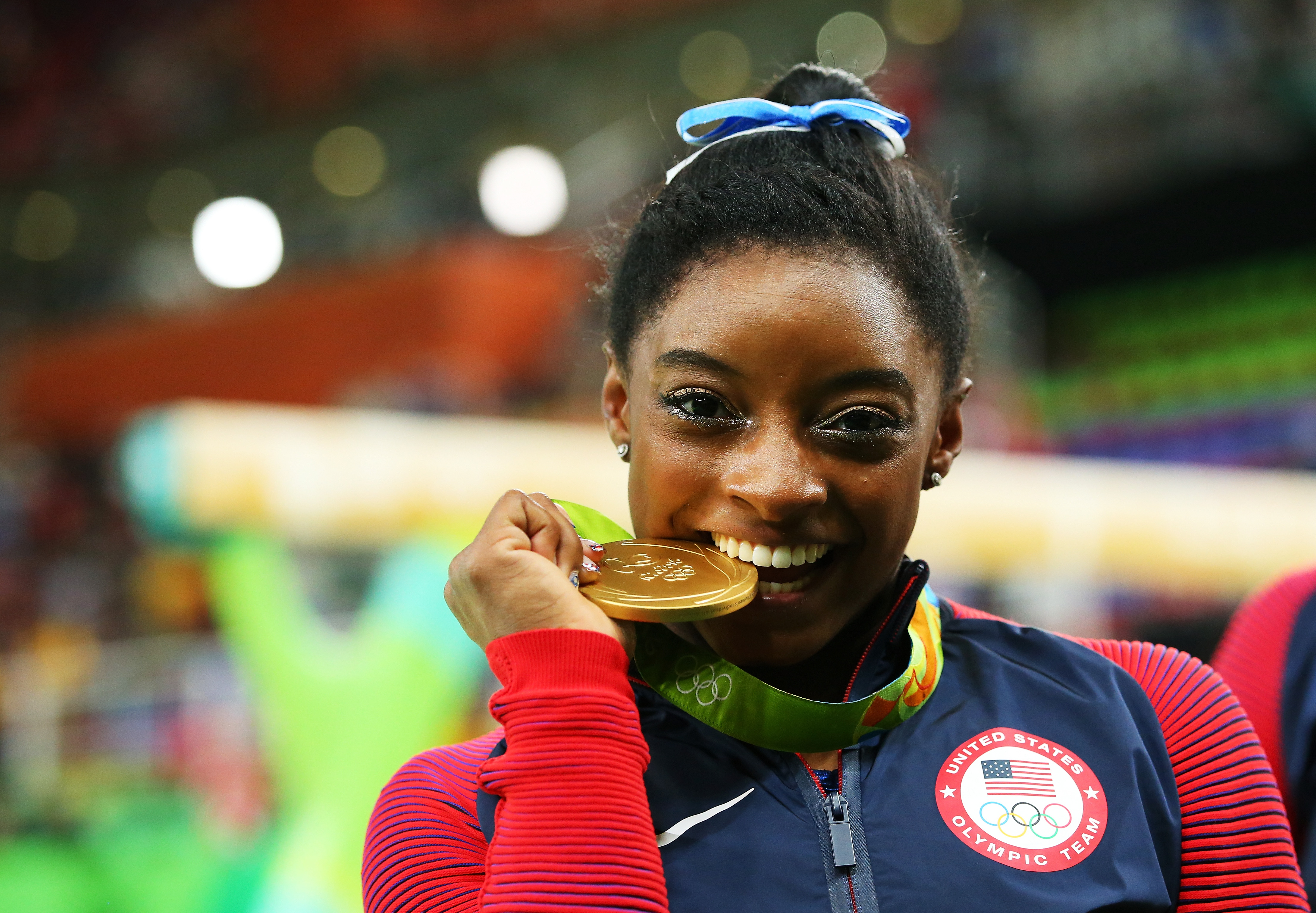 Simone Biles of the United States poses for photographs after the medal ceremony for the Women's Individual All Around on Day 6 of the 2016 Rio Olympics at Rio Olympic Arena on August 11, 2016 in Rio de Janeiro, Brazil. | Source: Getty Images