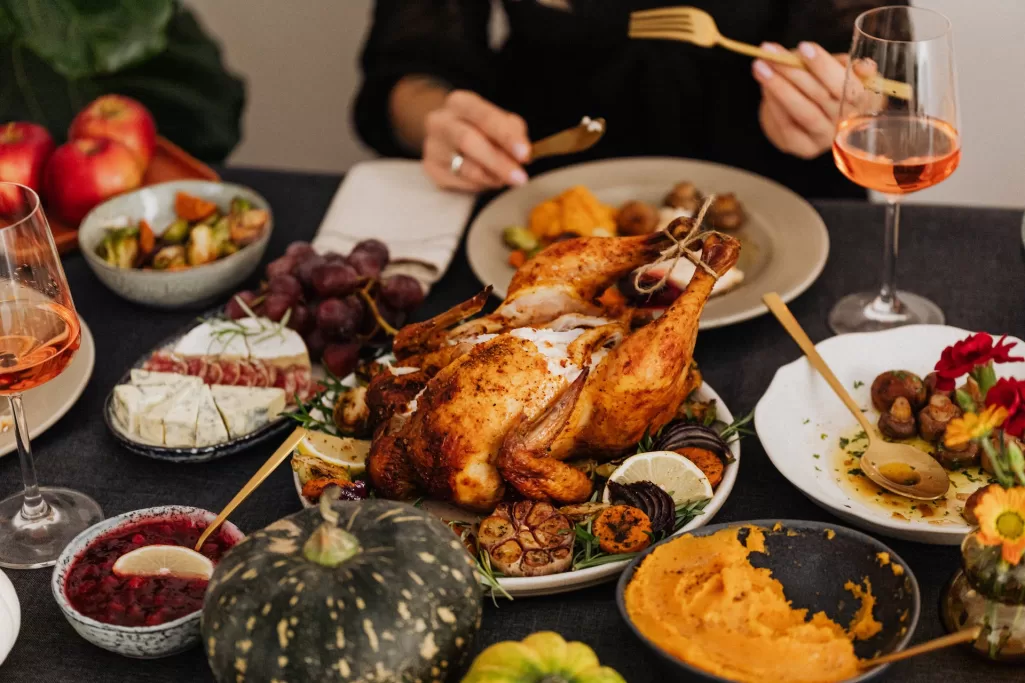 Roasted turkey and side dishes placed on the table for Thanksgiving dinner | Source: Pexels