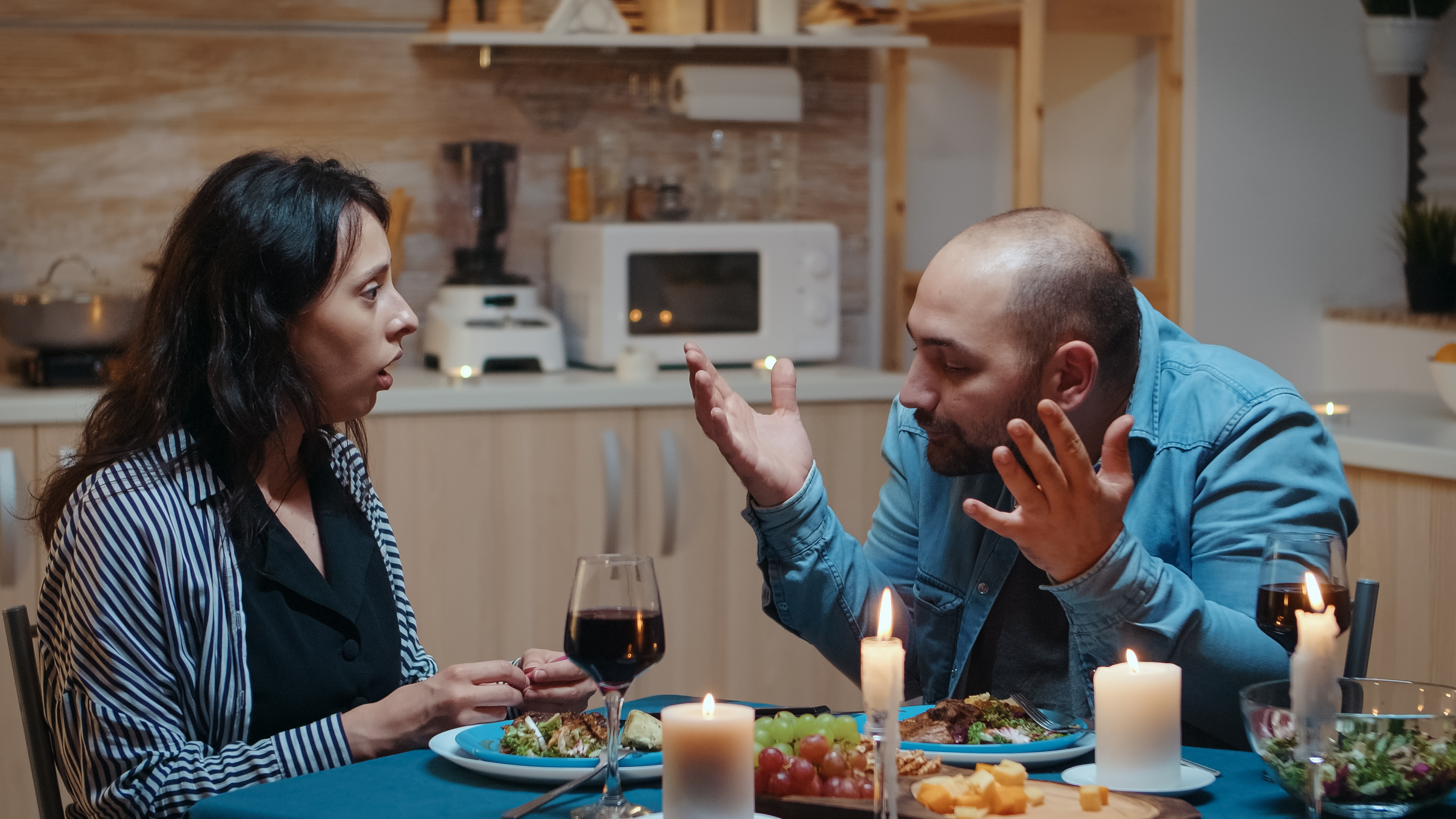 A man is arguing with his girlfriend during dinner | Source: Shutterstock