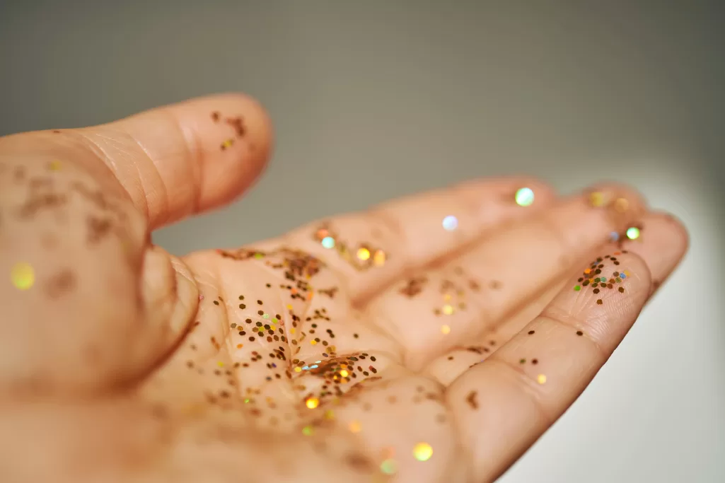 A woman's hand covered in glitter | Source: Getty Images
