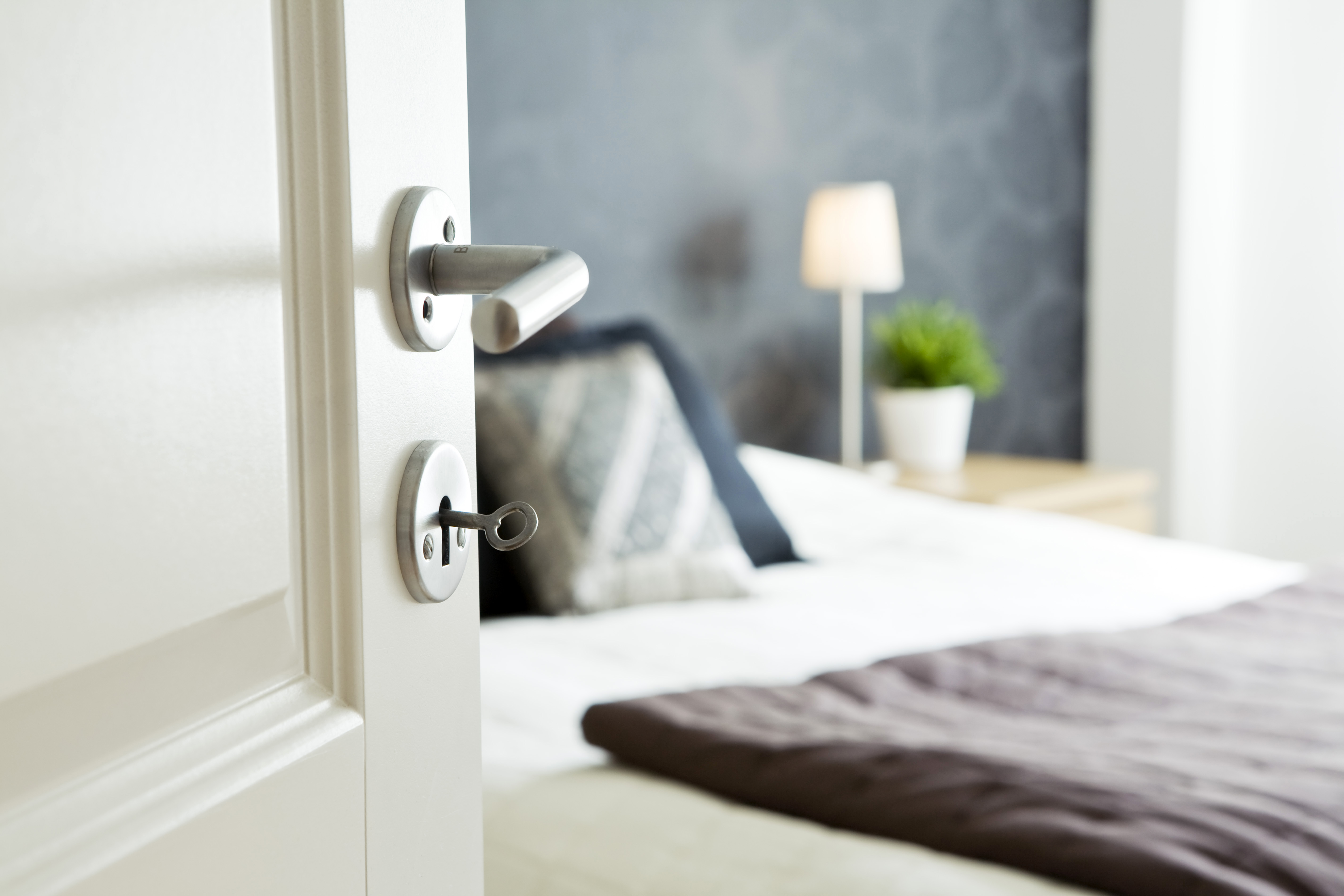 Open bedroom door with a key inside | Source: Getty Images