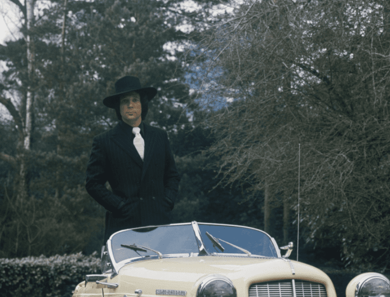 Pictured: An undated image of "The Voice" judge Tom Jones posing in his car | Source: Getty Images