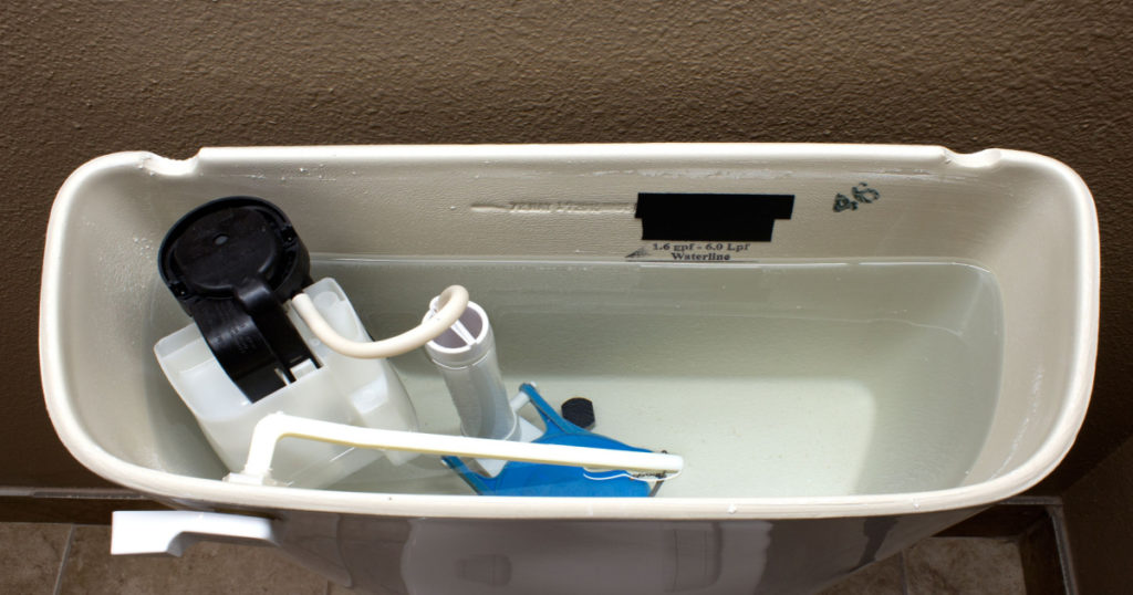 The internal mechanics of a modern flush toilet.
