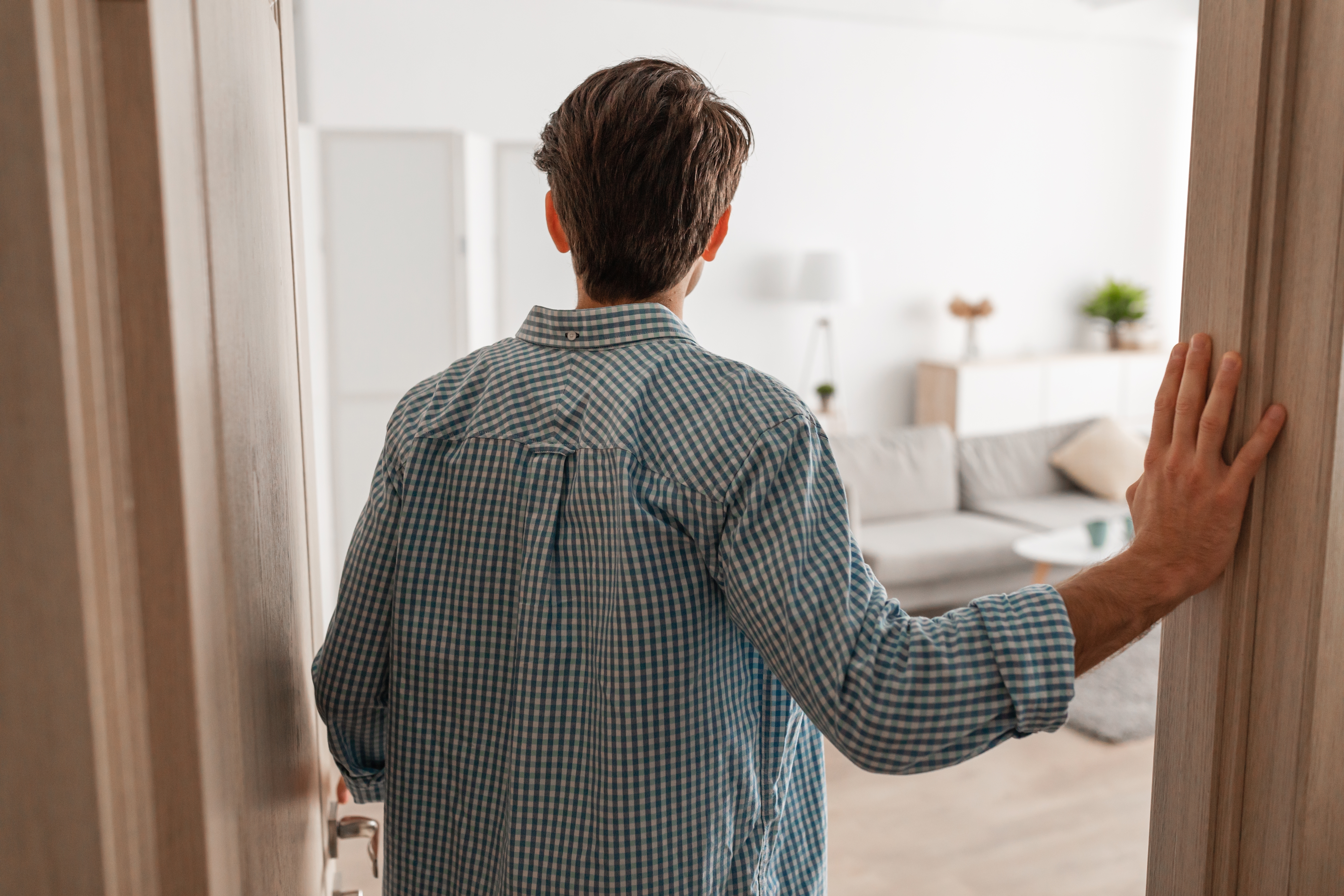 Man walking into his home | Source: Shutterstock