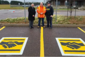 Here’s what a handshake symbol on a parking space means