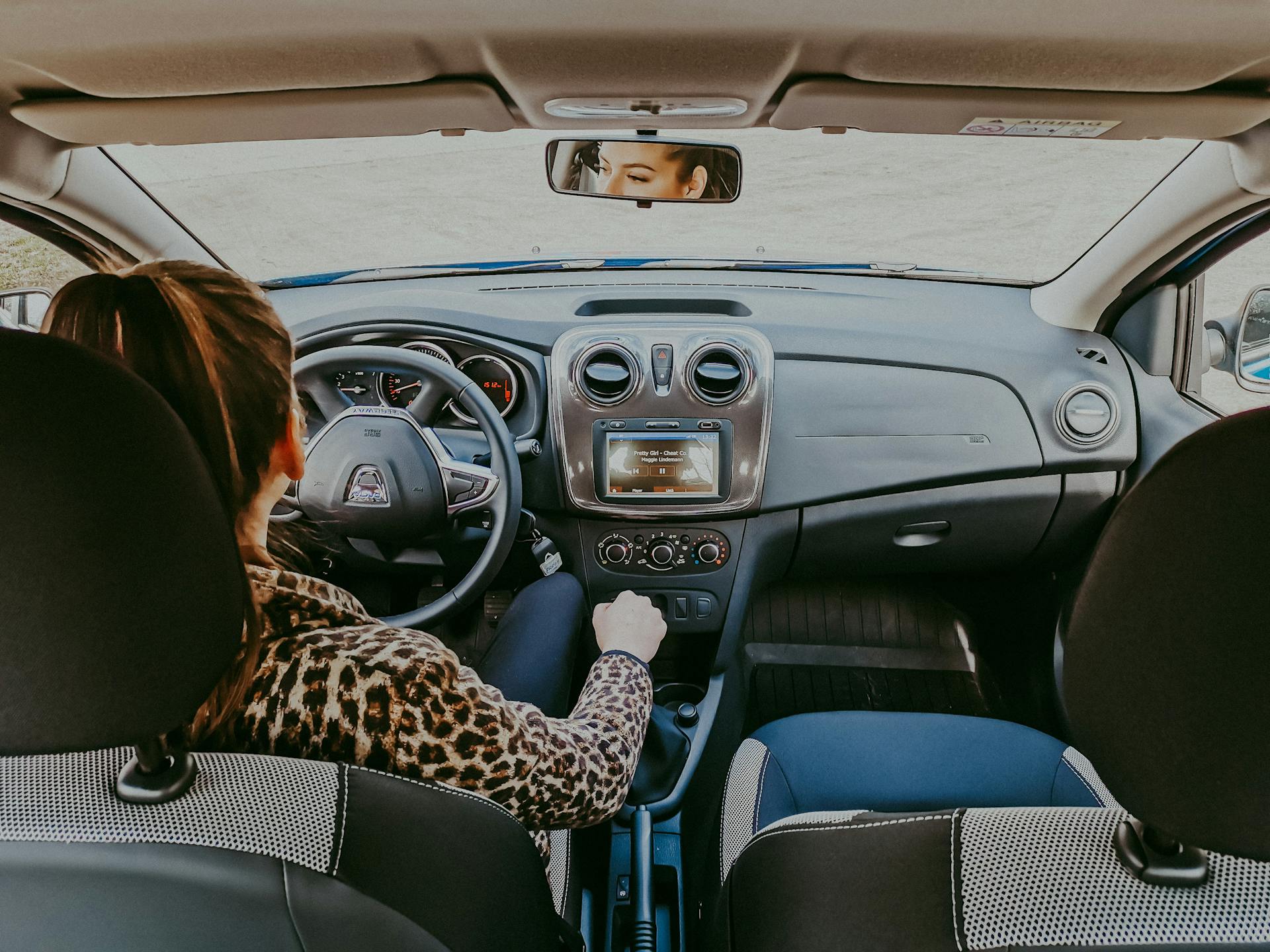 A woman driving a car | Source: Pexels