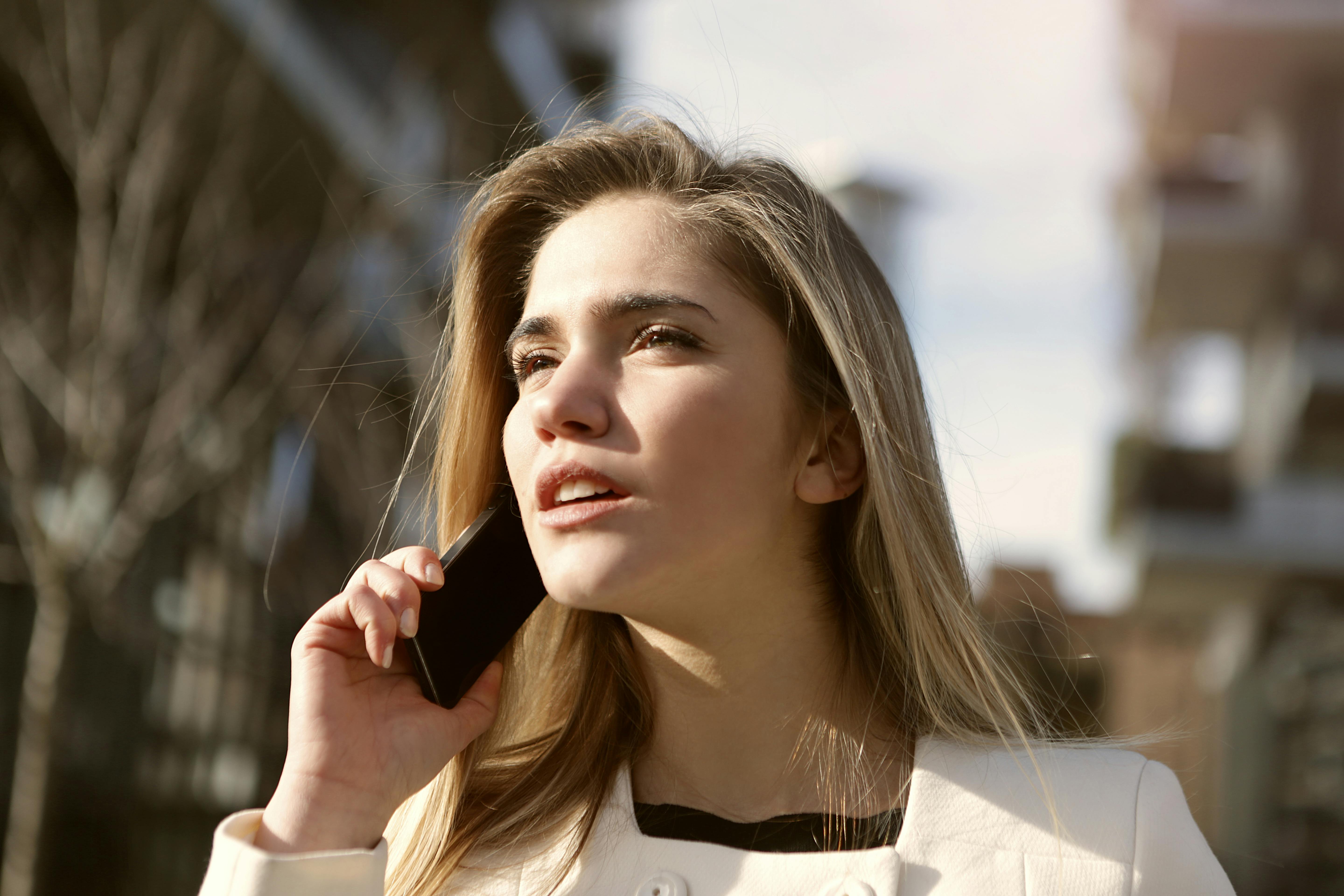 Woman talks on her phone | Source: Pexels