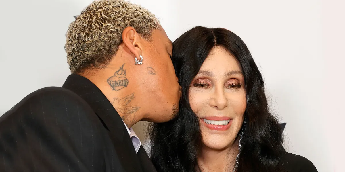 ‘What’s Going on with His Teeth?’: Users Discuss Cher’s Appearance with Partner Alexander Edwards at VS Show