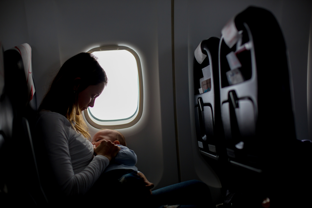 Plus size woman buying two seats on airplane