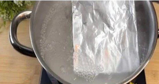 Putting a Sheet of Aluminum Foil in Boiling Water