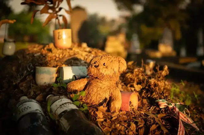 Toys found in front of grave