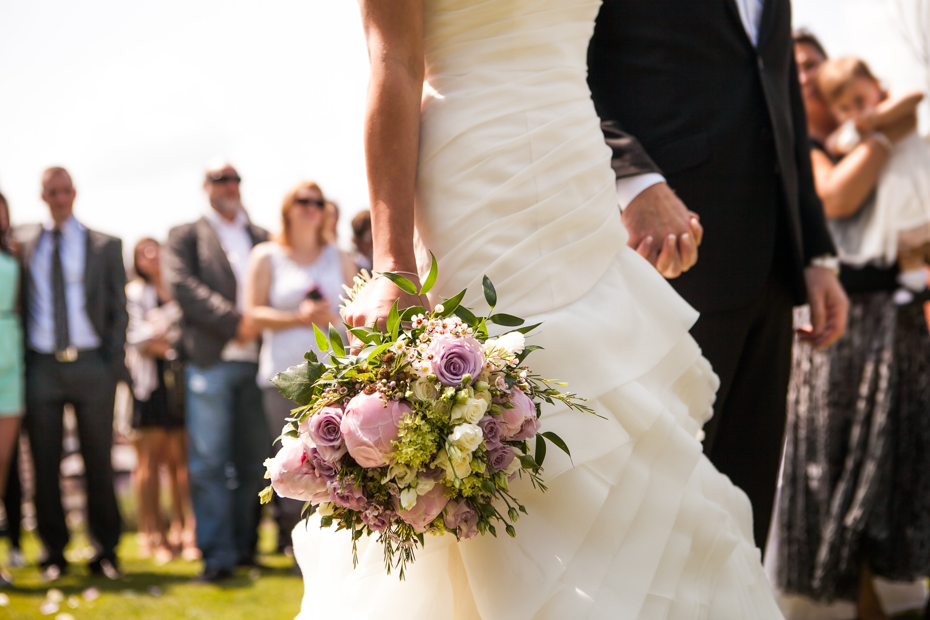 A bride and groom holding hands at their wedding | Source: Shutterstock