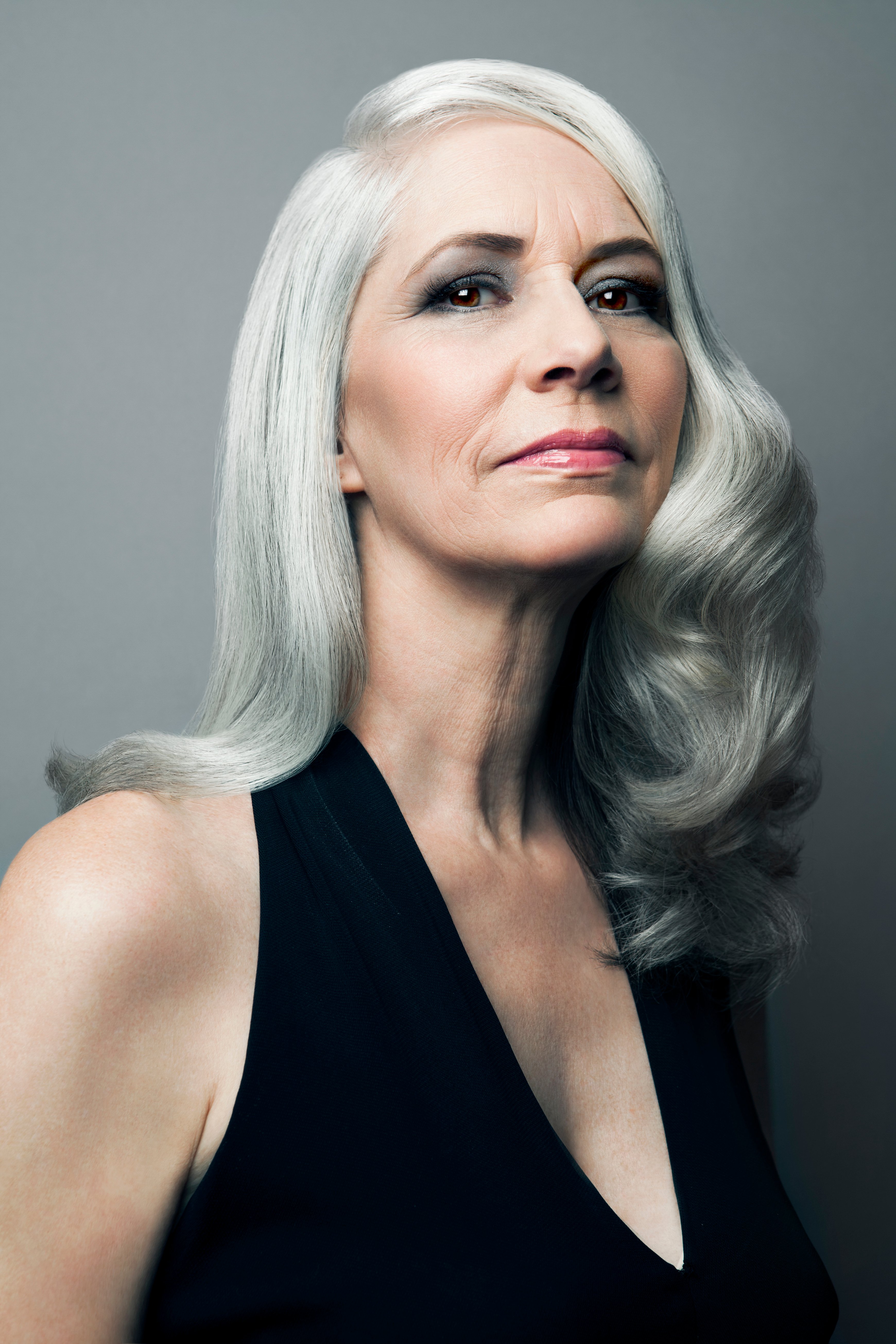 A senior woman in a black dress | Source: Getty Images