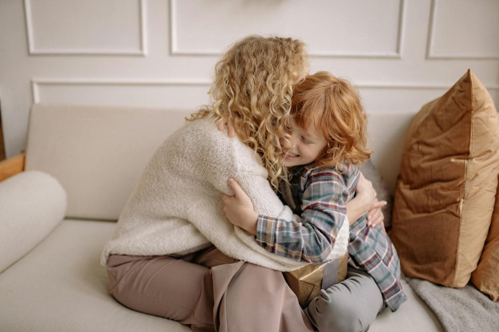 A woman hugging her son | Source: Pexels