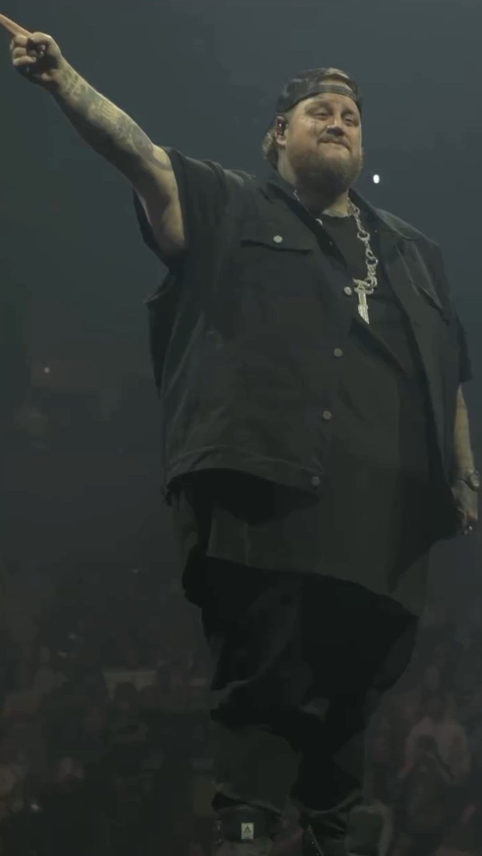 Jelly Roll raises his hands during the "Beautifully Broken" Tour. | Source: Instagram.com/jellyroll615