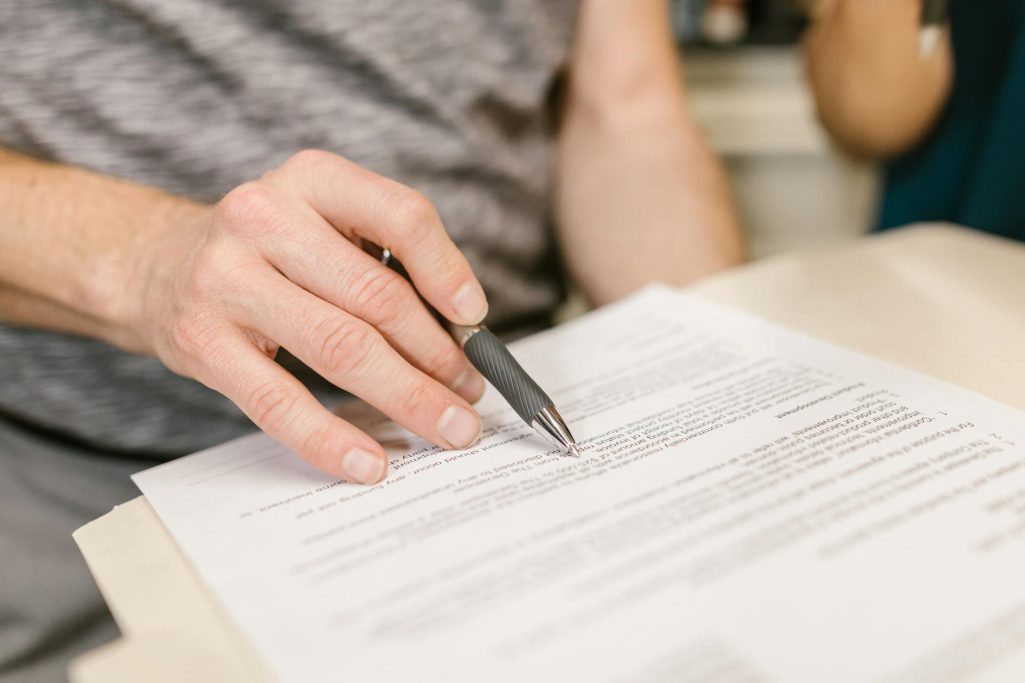 A person looking at a document | Source: Pexels