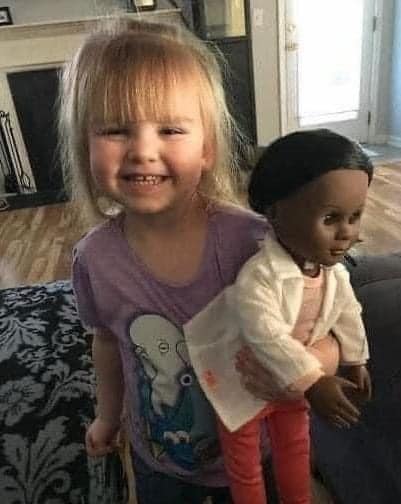 Two year old has the perfect response for cashier who questioned black doll