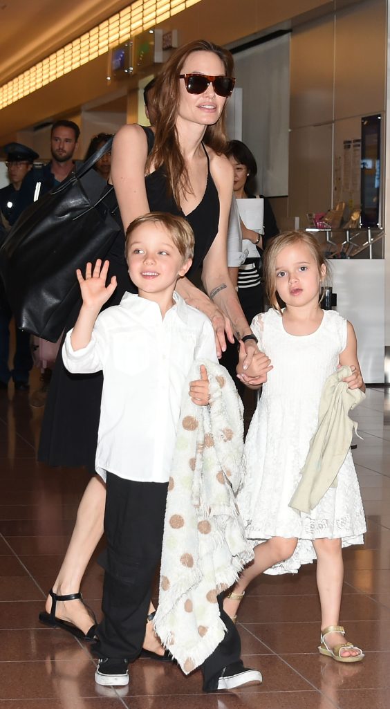 Angelina and Vivienne Jolie with Knox Jolie-Pitt at Haneda Airport in Tokyo, Japan on June 21, 2014 | Source: Getty Images