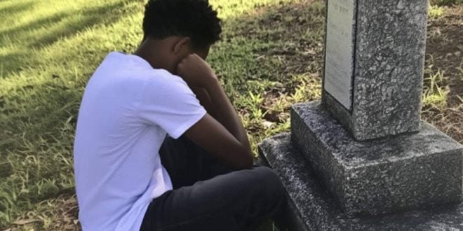 A boy discovers an envelope with his name at the grave of his adoptive mother