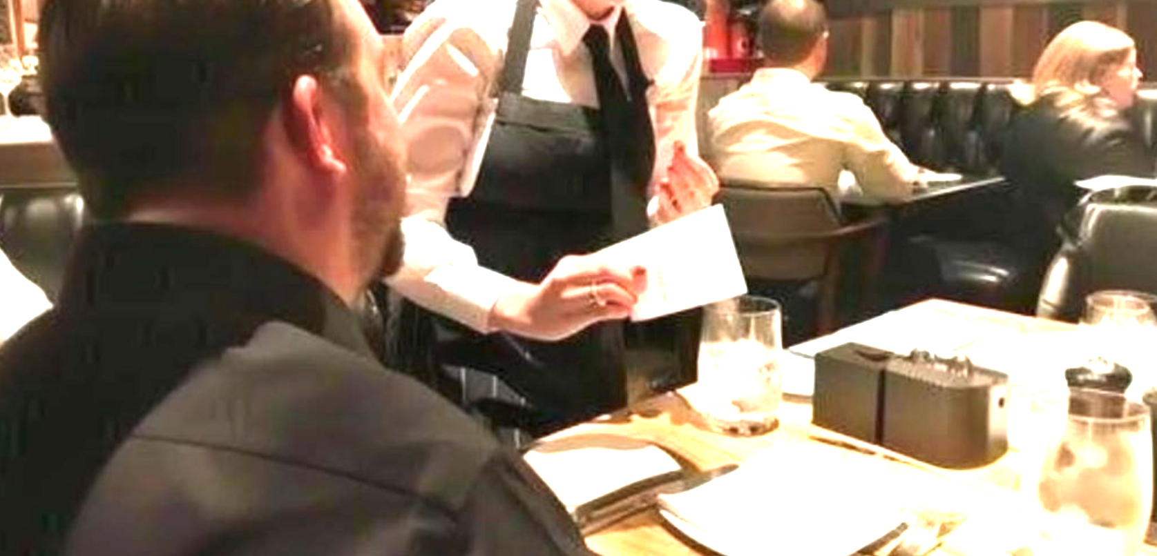 A stunning waitress handed my husband a note – his face flushed as he read it