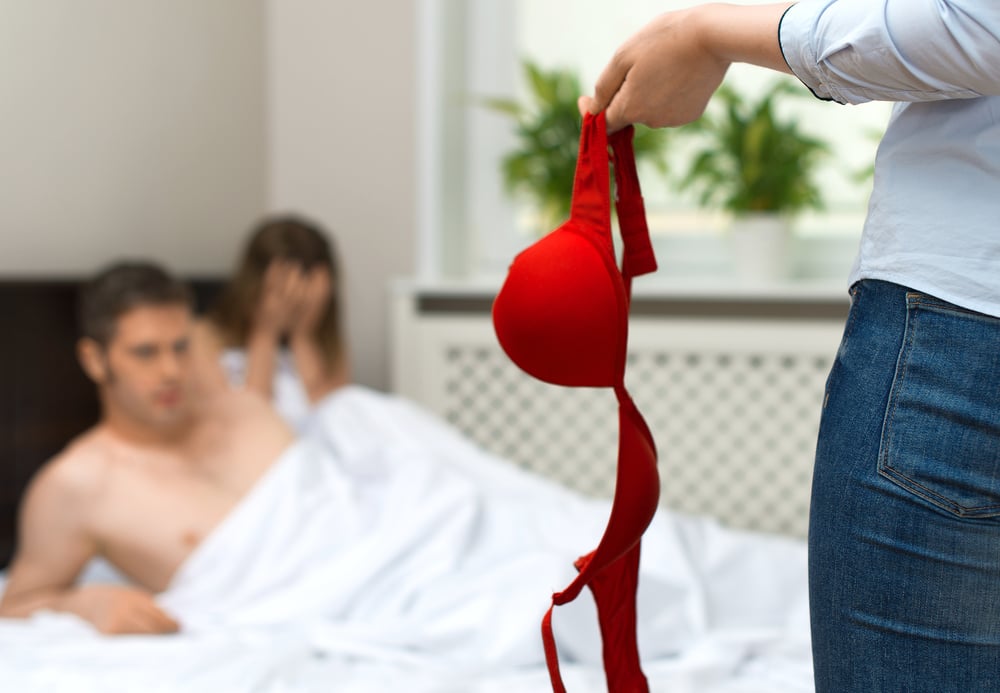 A man and woman caught in bed | Source: Shutterstock