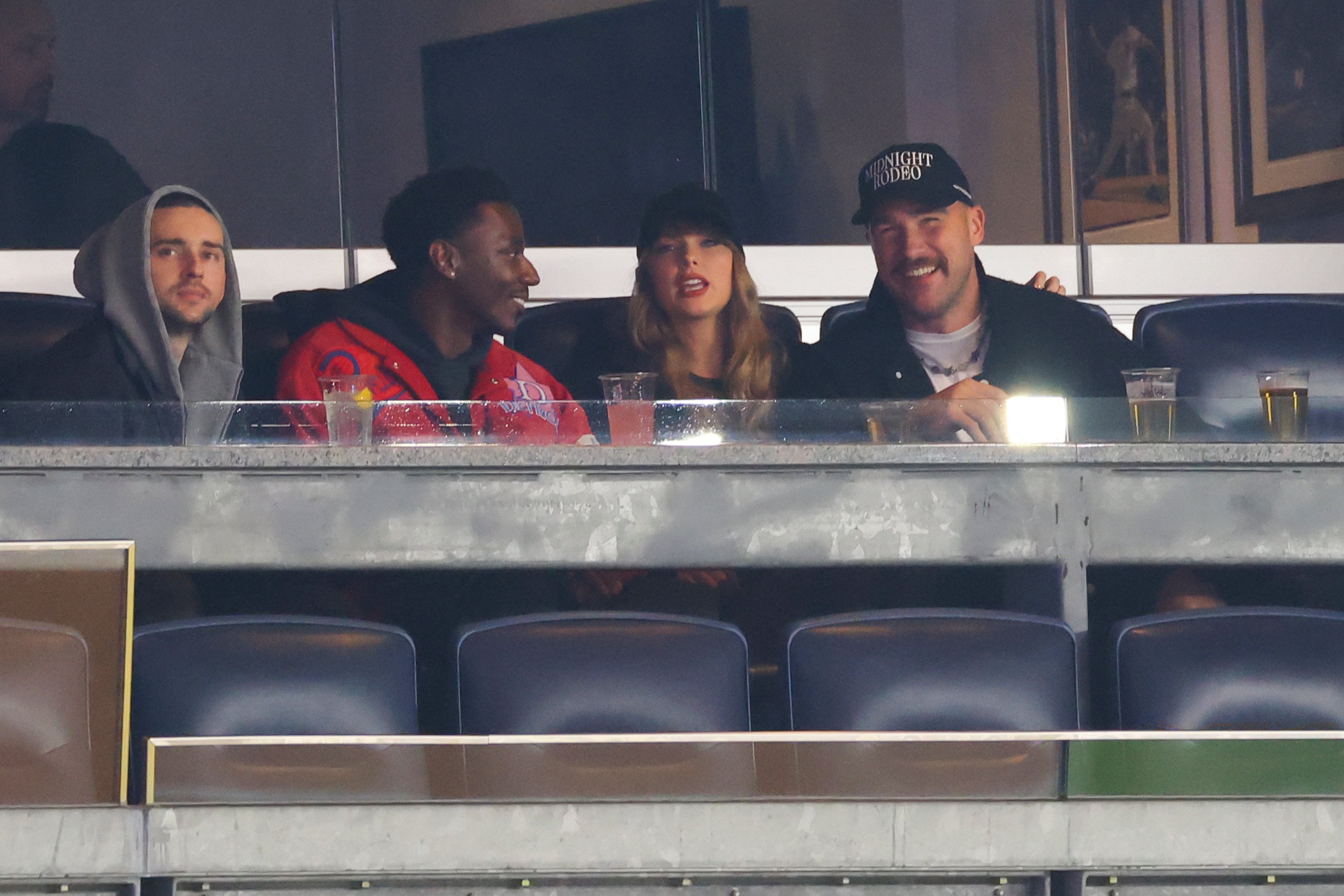 Jerrod Carmichael, Taylor Swift and Travis Kelce attend Game One of the American League Championship Series at Yankee Stadium on October 14, 2024, in New York City | Source: Getty Images