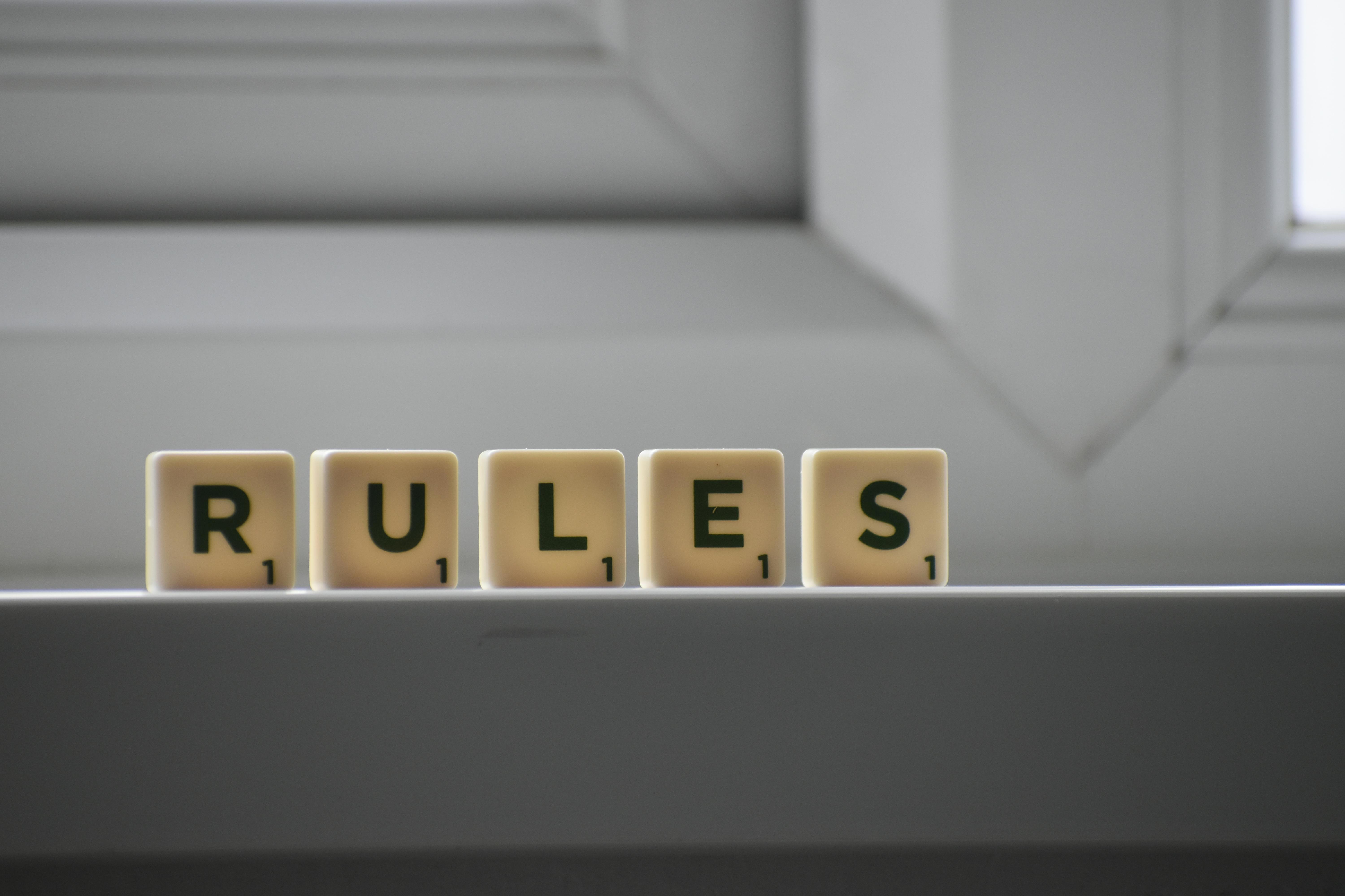 Identical cubes with RULES inscription | Source: Pexels