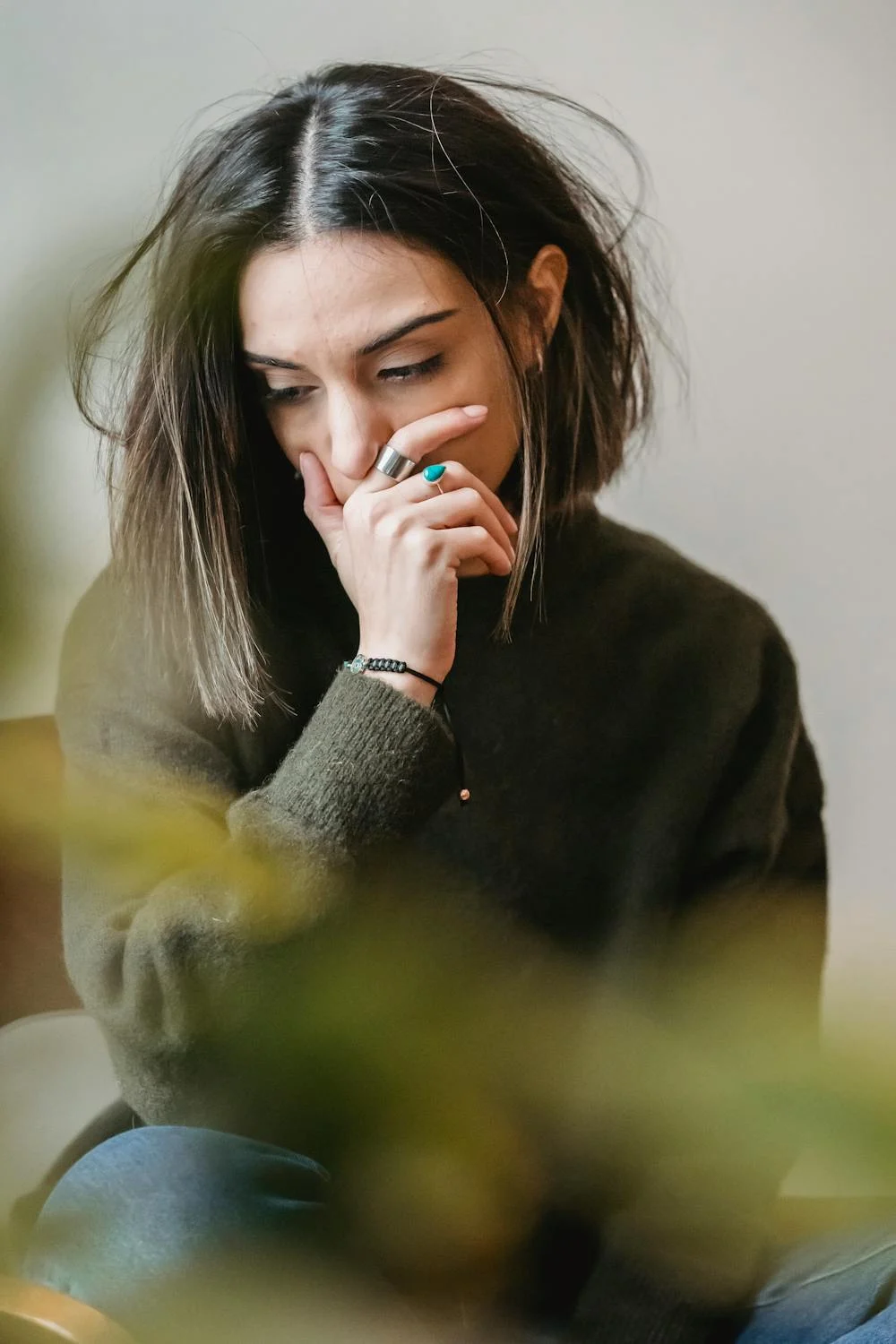 A sad young woman deep in thought | Source: Pexels