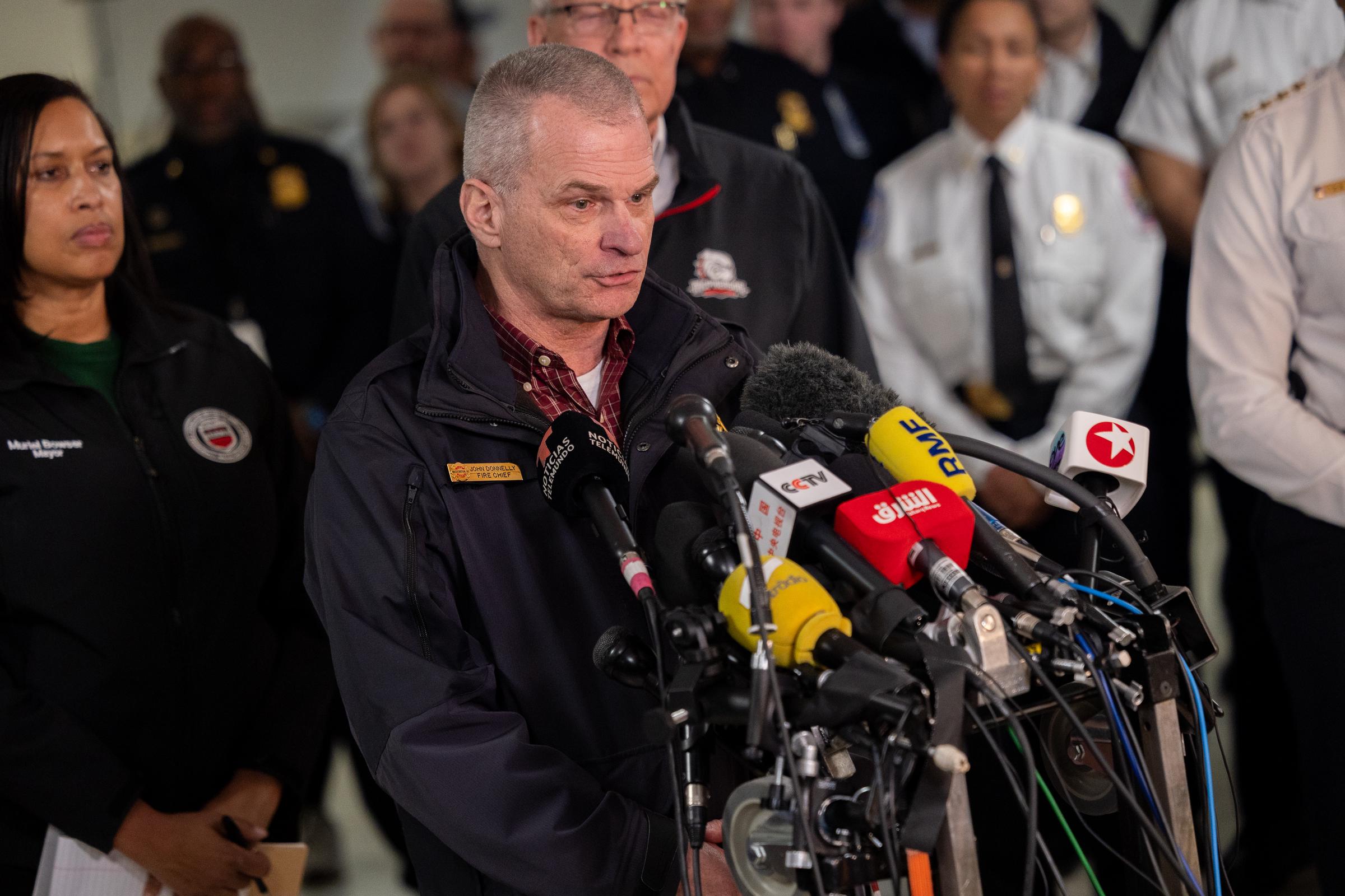 DC Fire and EMS Chief John Donnelly speaking at a press conference with other government officials on the rescue efforts following a collision between an American Airlines plane and an Army helicopter in Washington, D.C. on January 30, 2025. | Source: Getty Images