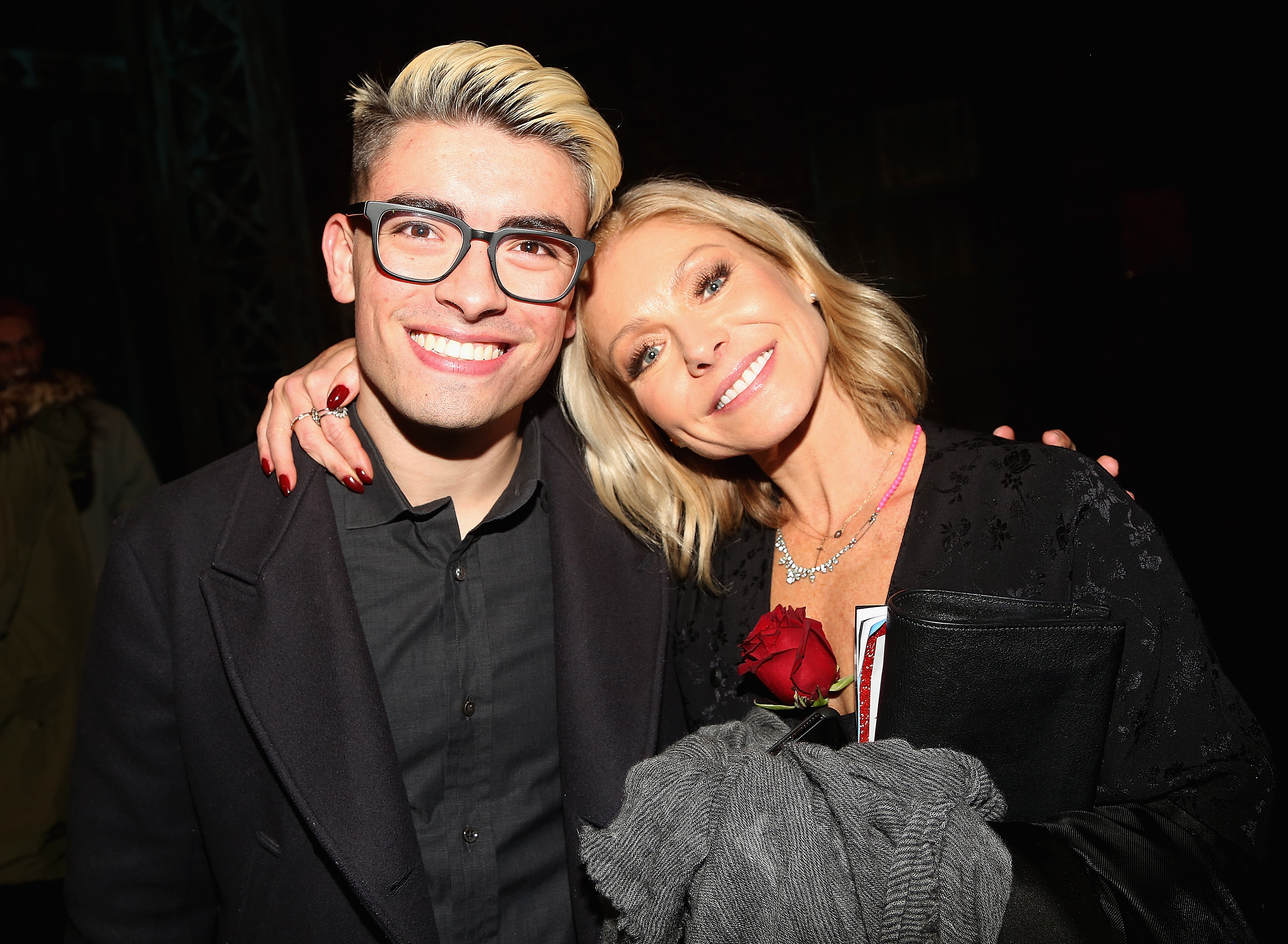 Michael Consuelos and Kelly Ripa pose backstage at The Al Hirschfeld Theatre on January 8, 2018, in New York City. | Source: Getty Images