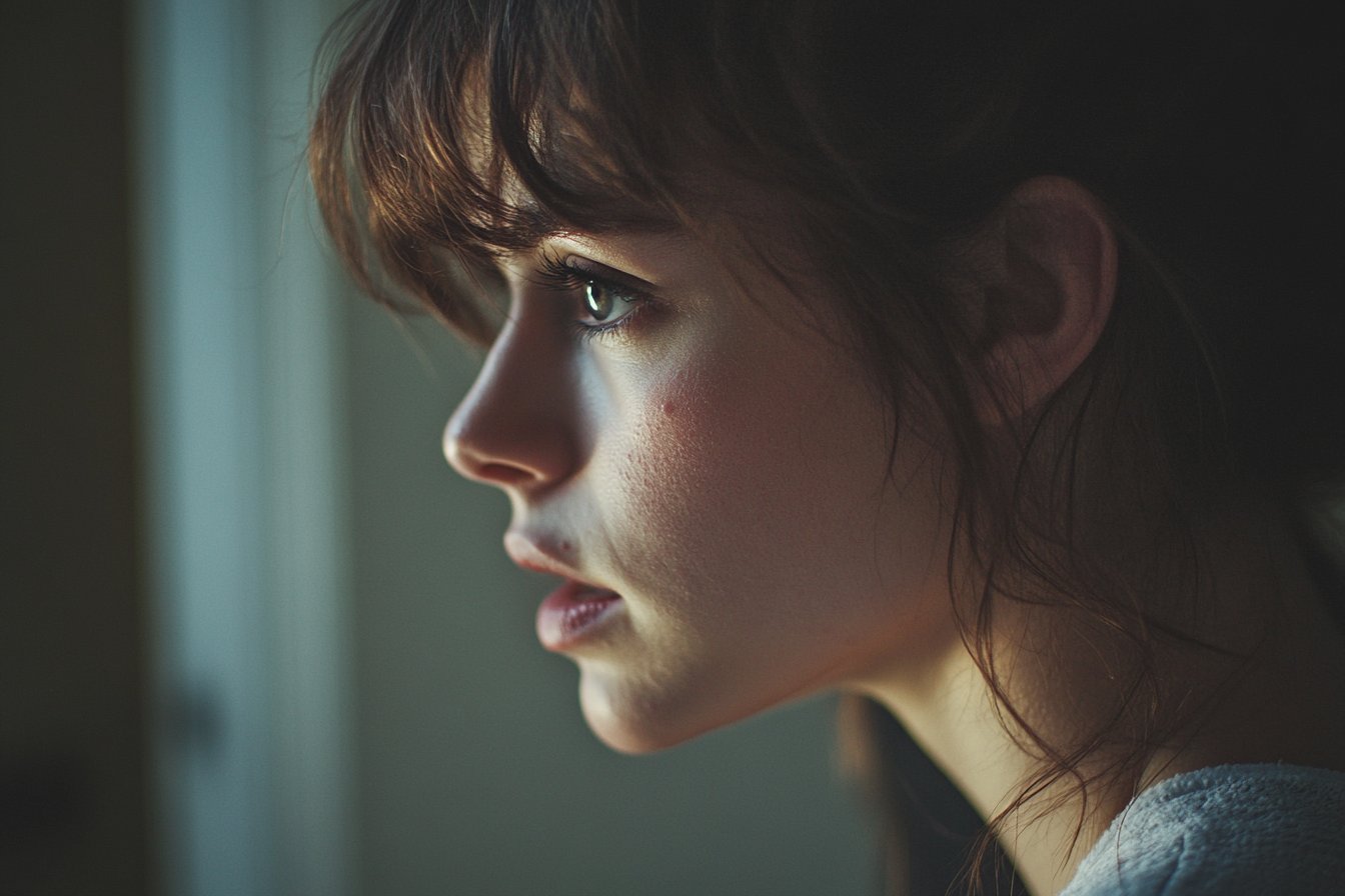 A side-view shot of a woman's face | Source: Midjourney