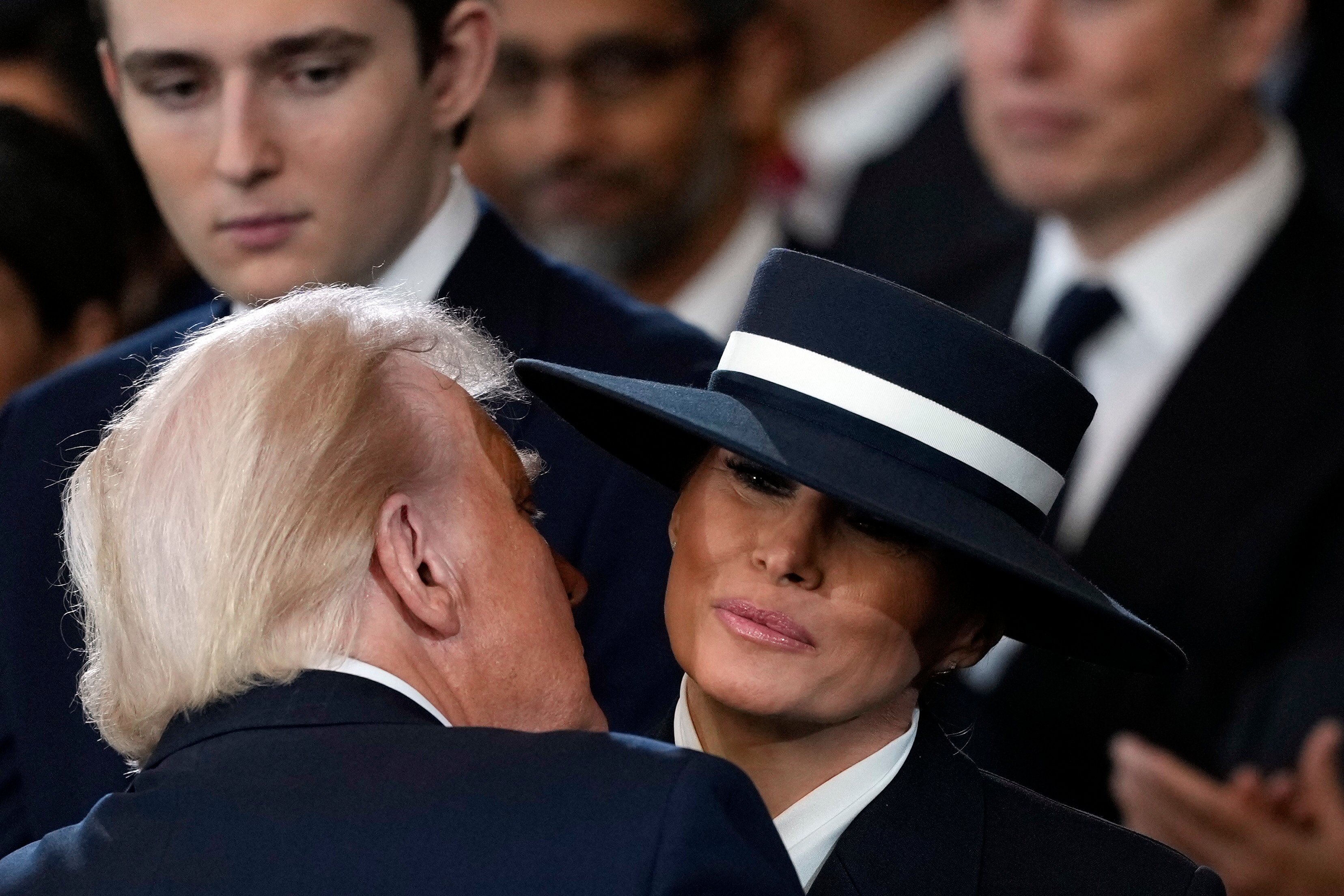 Donald and Melania Trump sharing an air kiss. | Source: Getty Images