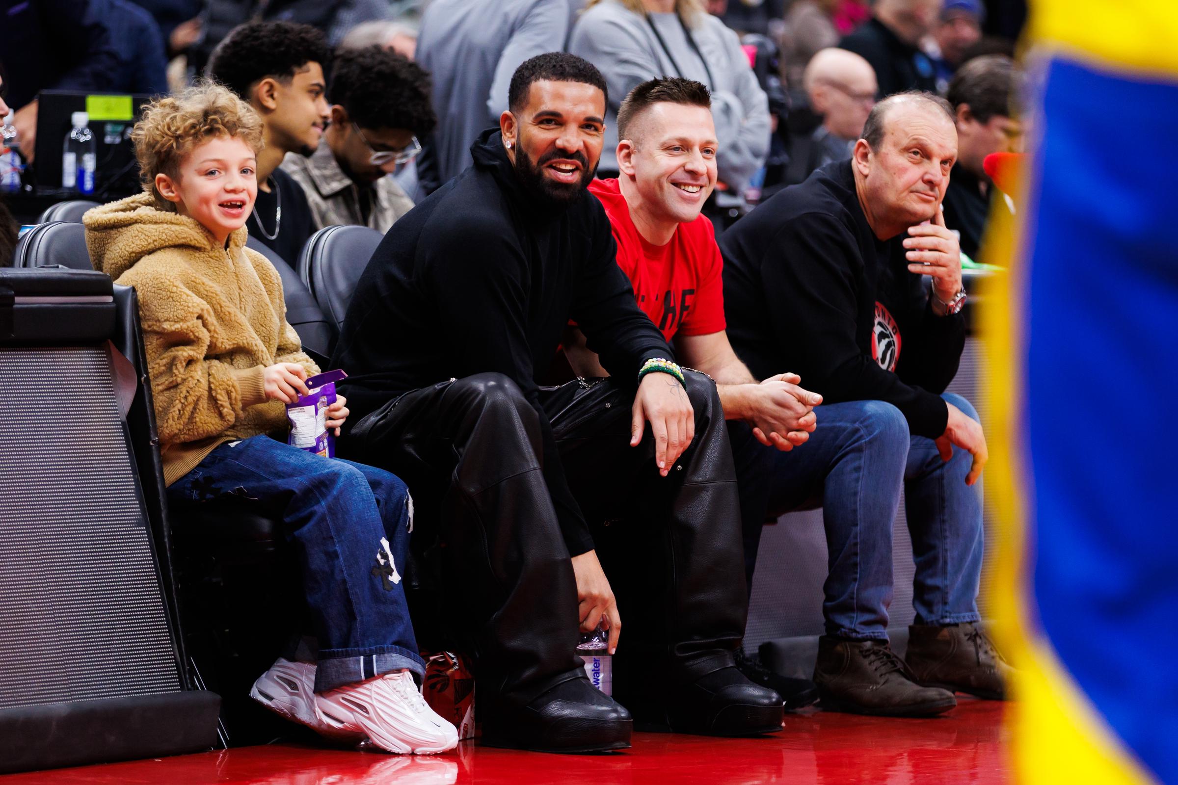 Adonis and Drake are seen courtside during the first half of the NBA game between the Toronto Raptors and the Golden State Warriors at Scotiabank Arena in Toronto, Canada, on January 13, 2025 | Source: Getty Images