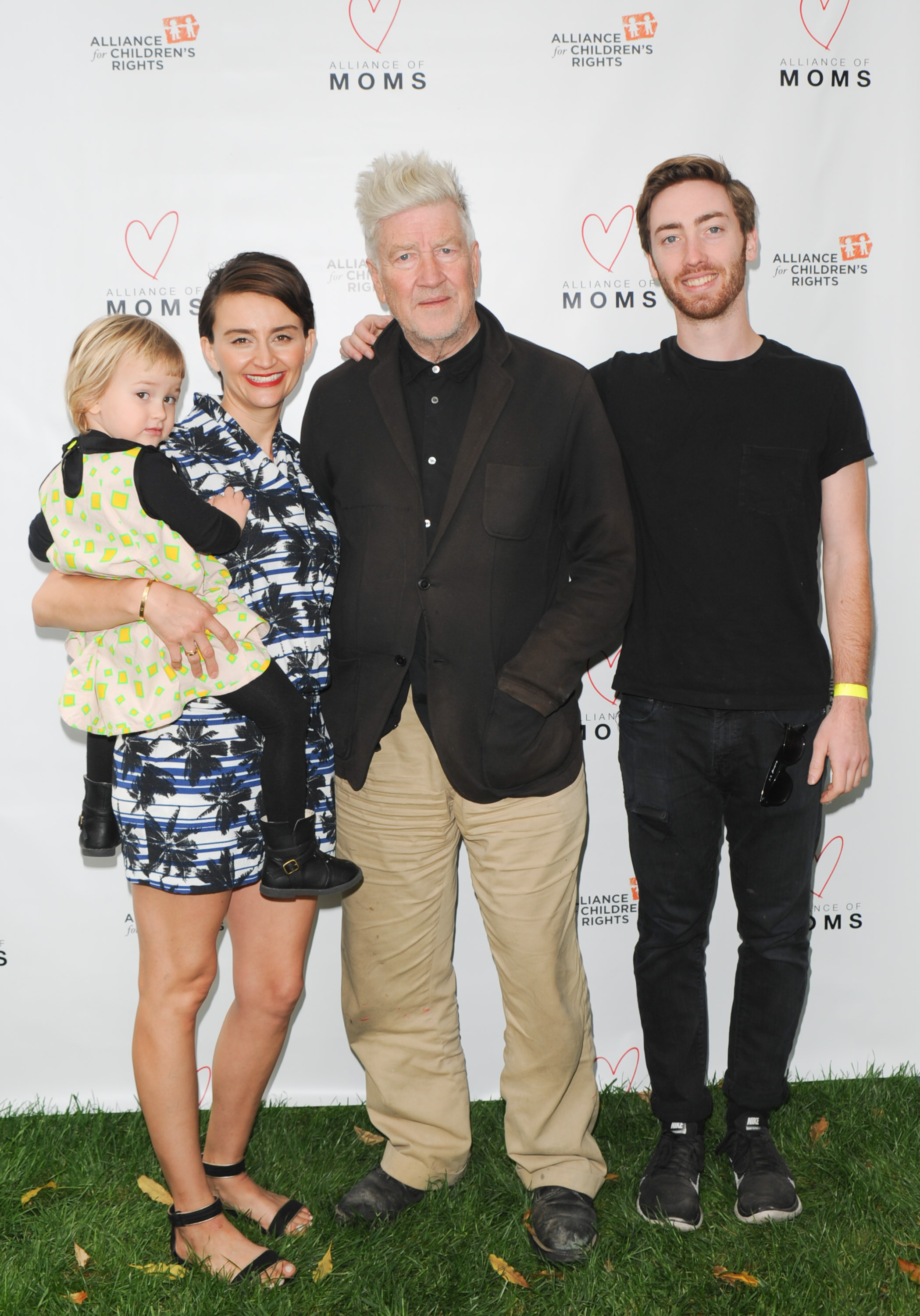 Emily Stofle with David Lynch and his son Riley at the Alliance of Moms Giant Playdate event on May 9, 2015, in Los Angeles, California. | Source: Getty Images