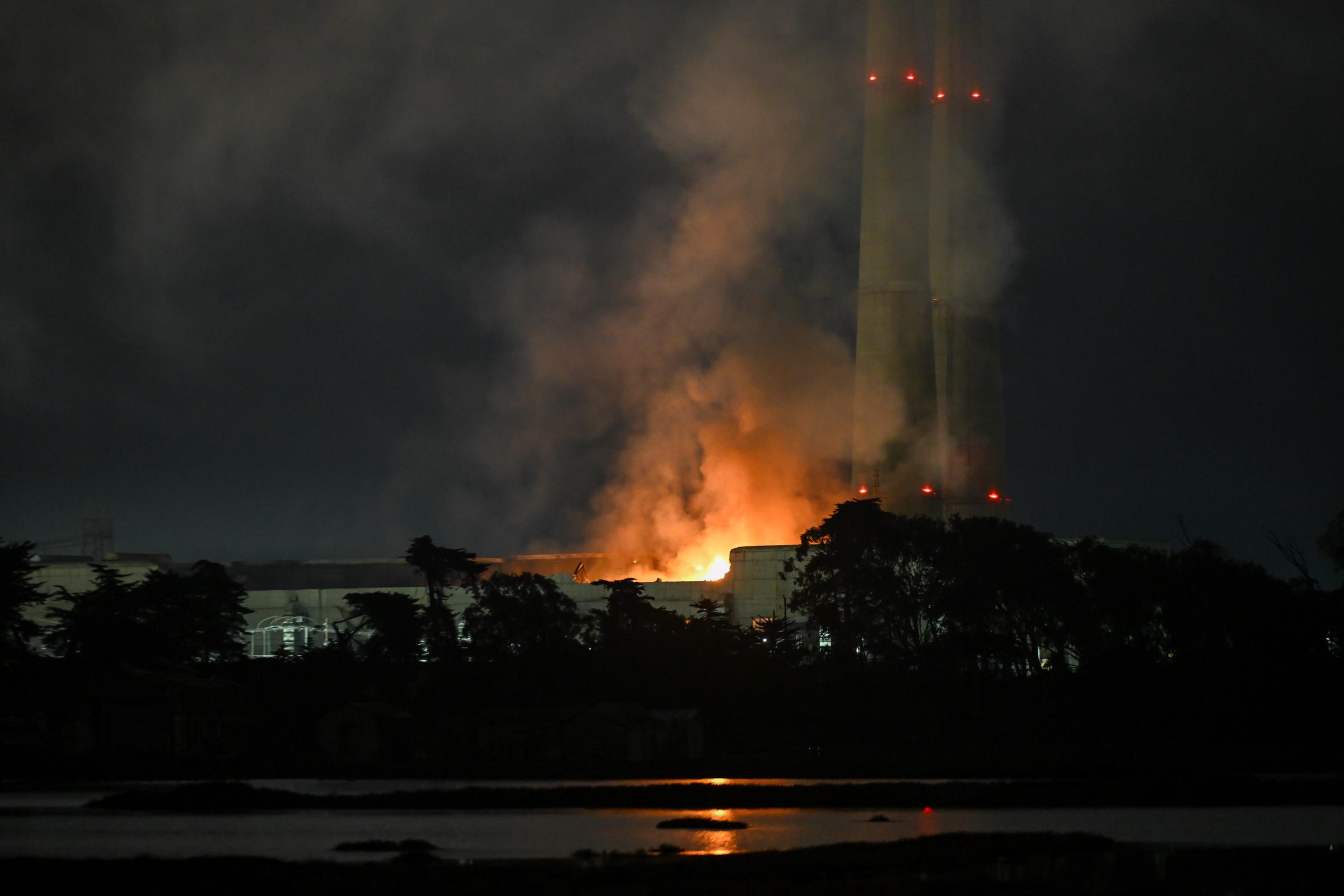 A view of flames and giant smoke over the sky after a fire erupted at Moss Landing Power Plant in Monterey Bay, California, on January 17, 2025. | Source: Getty Images