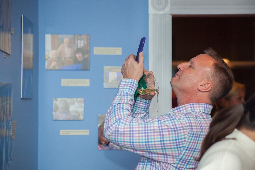 Perfectly timed photo of man spilling wine