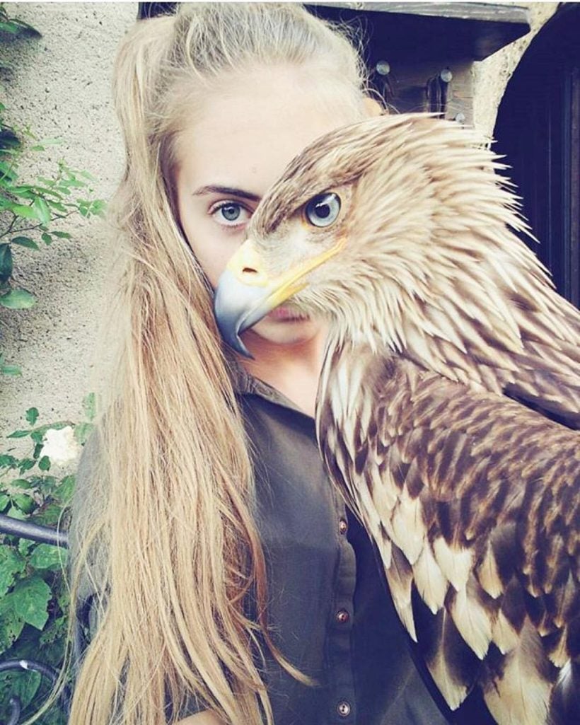 Amazing well timed photo of girl with eagle