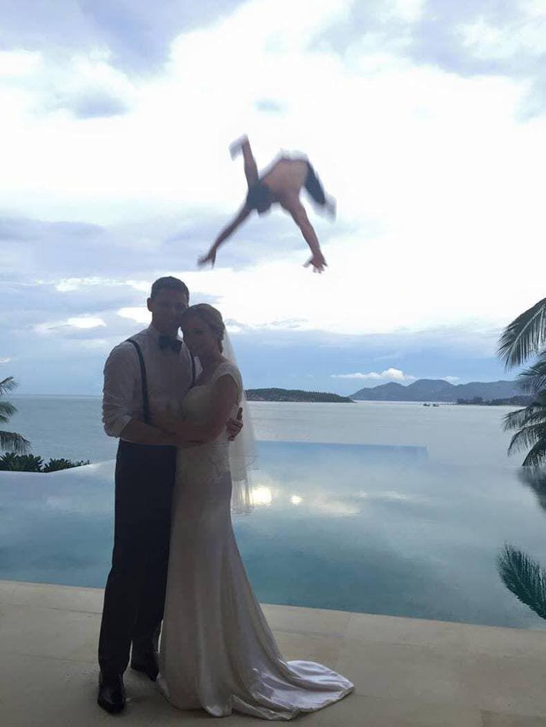 Funny photo of man falling from sky behind married couple