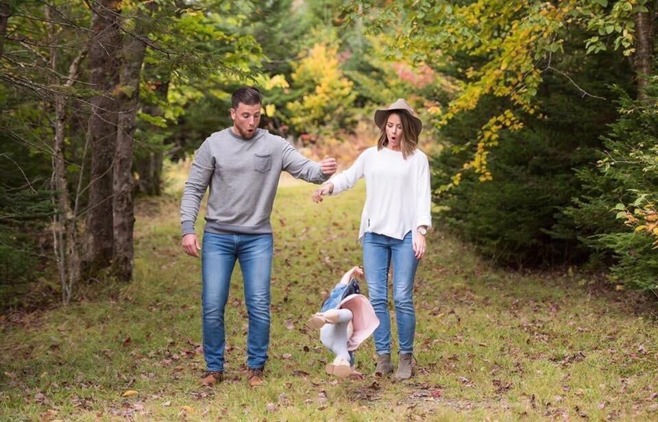 Well timed photo of parents dropping baby