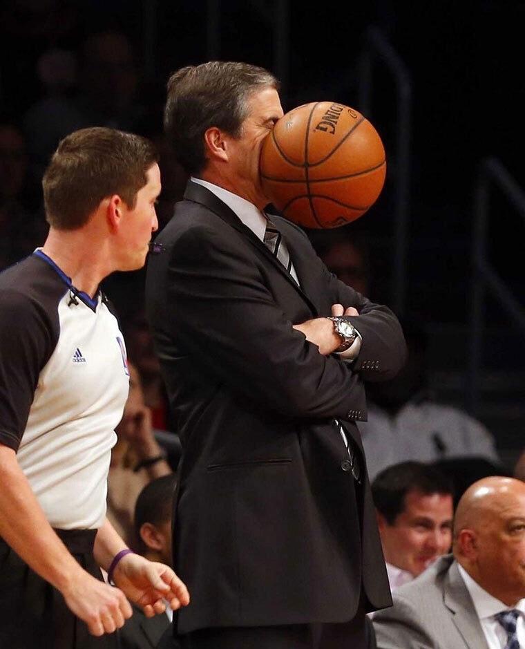 perfectly timed photo of basketball hitting face