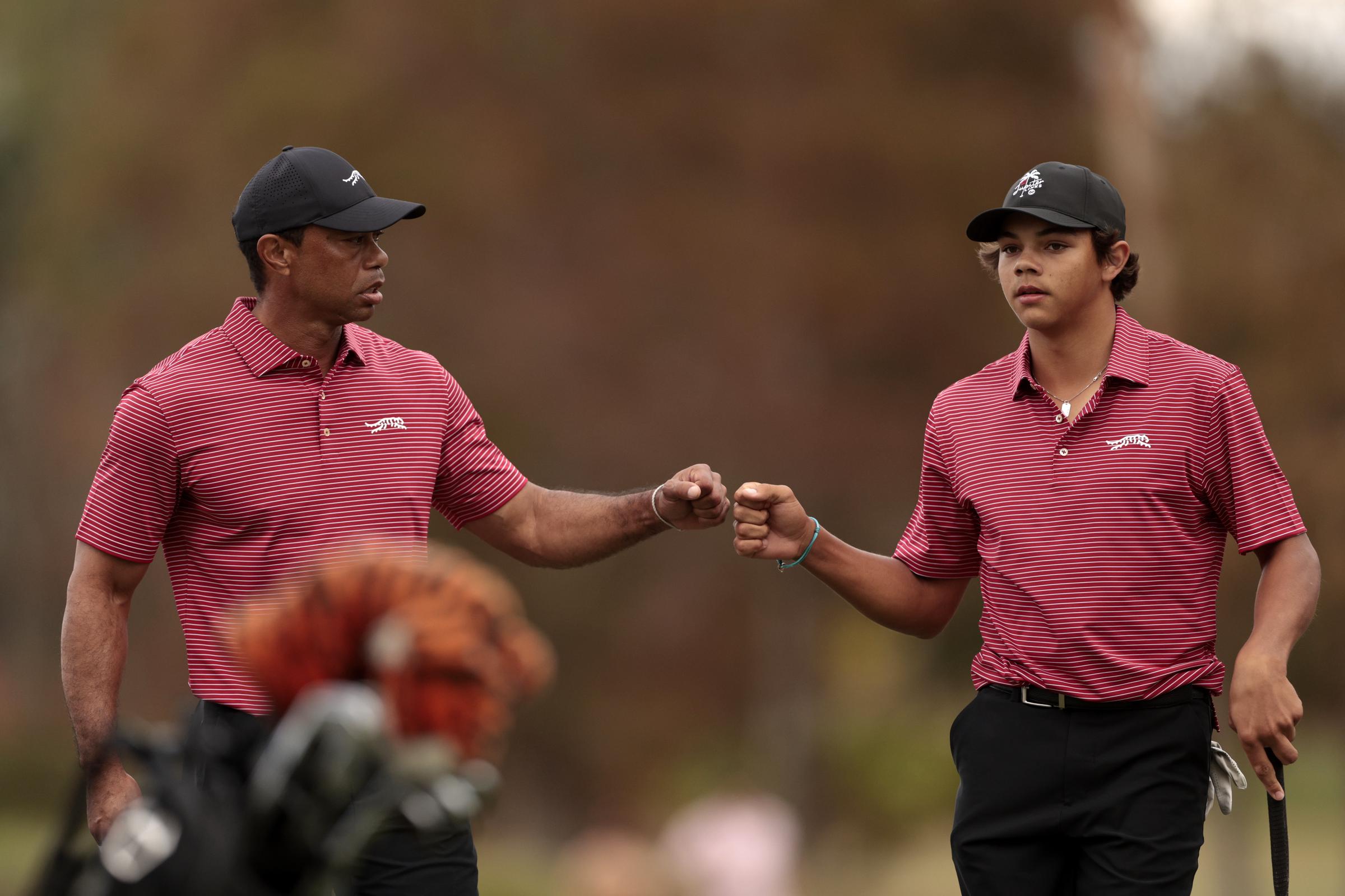 Tiger Woods and his son Charlie react on the 16th green during the second round of the 2024 PNC Championship in Orlando on December 22, 2024 | Source: Getty Images