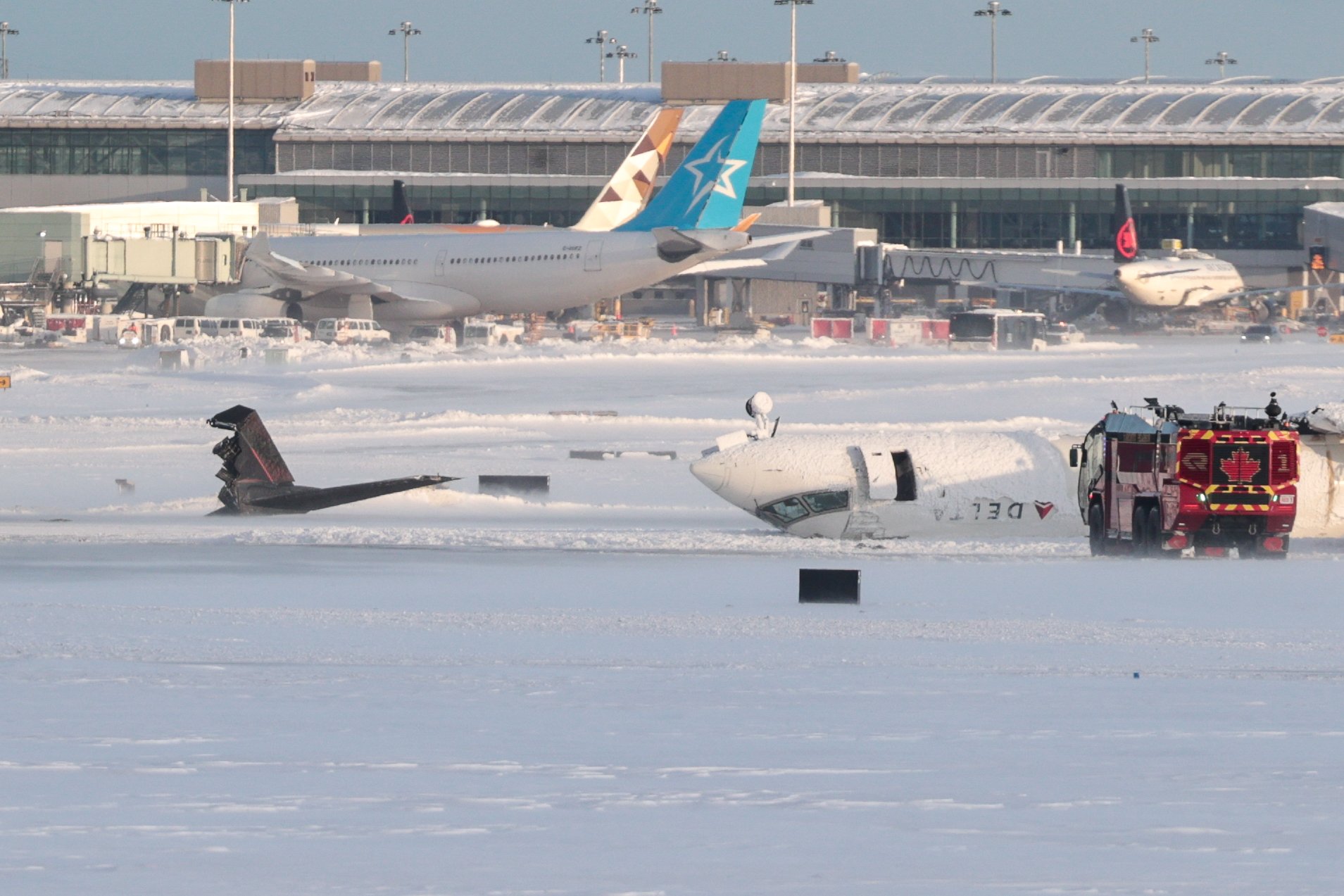 Delta airplane seen overturned on the runway after crashing while landing on February 17, 2025, in Toronto, Canada. | Source: Getty Images